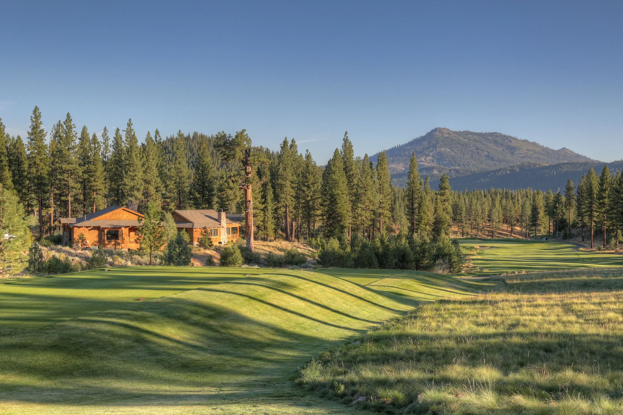 Grizzly Ranch Golf Club — fairway stripes with Sierra Nevada mountain backdrop