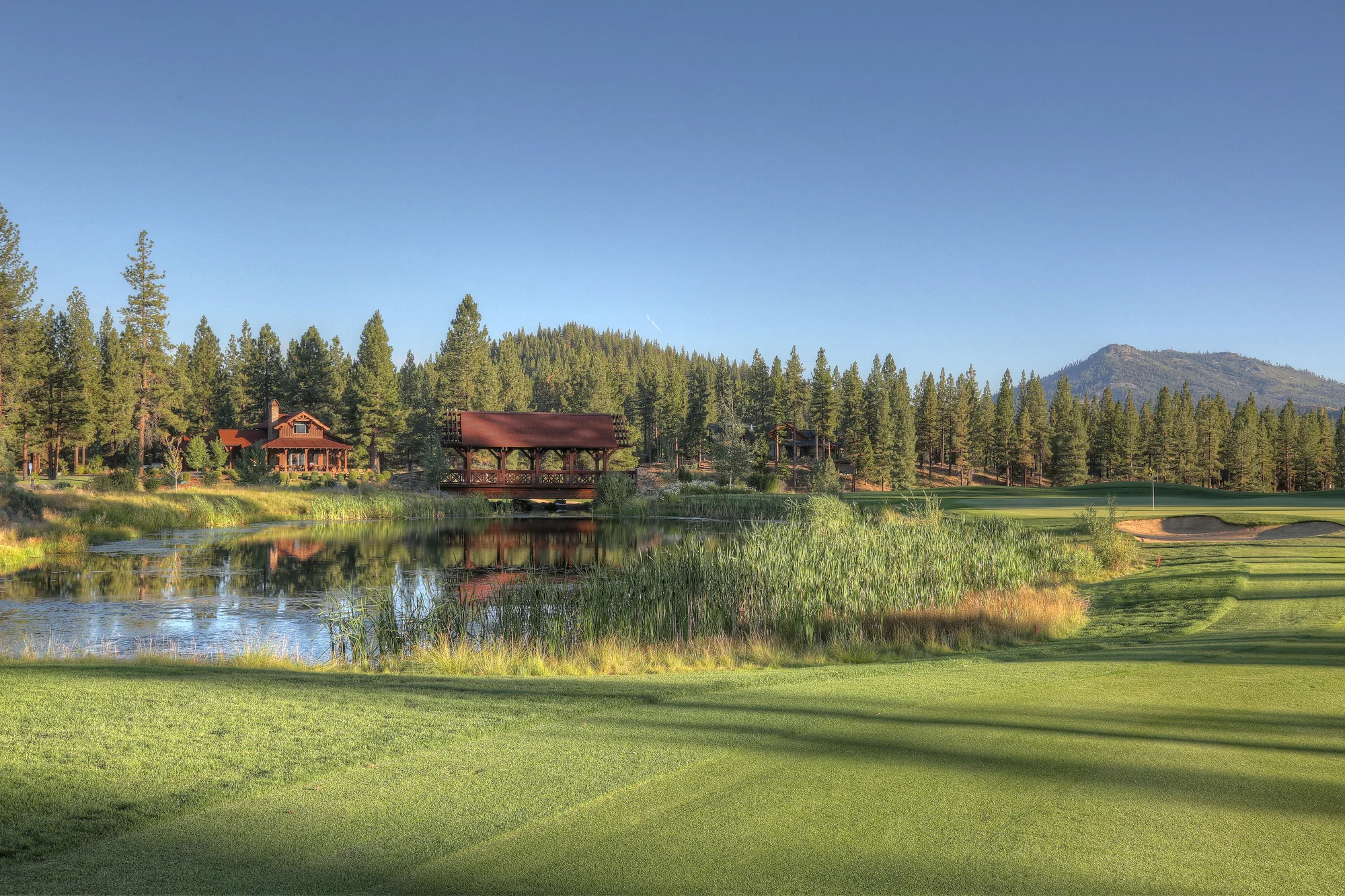 Grizzly Ranch Golf Club — 9th hole pavilion and pond reflection
