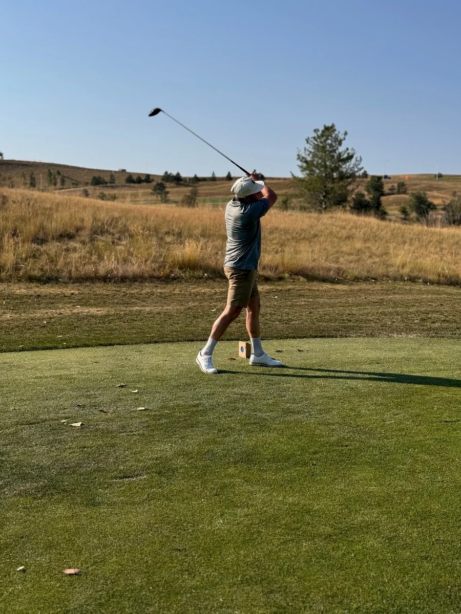 The Apex Classic 2025 — tee shot, mountain backdrop