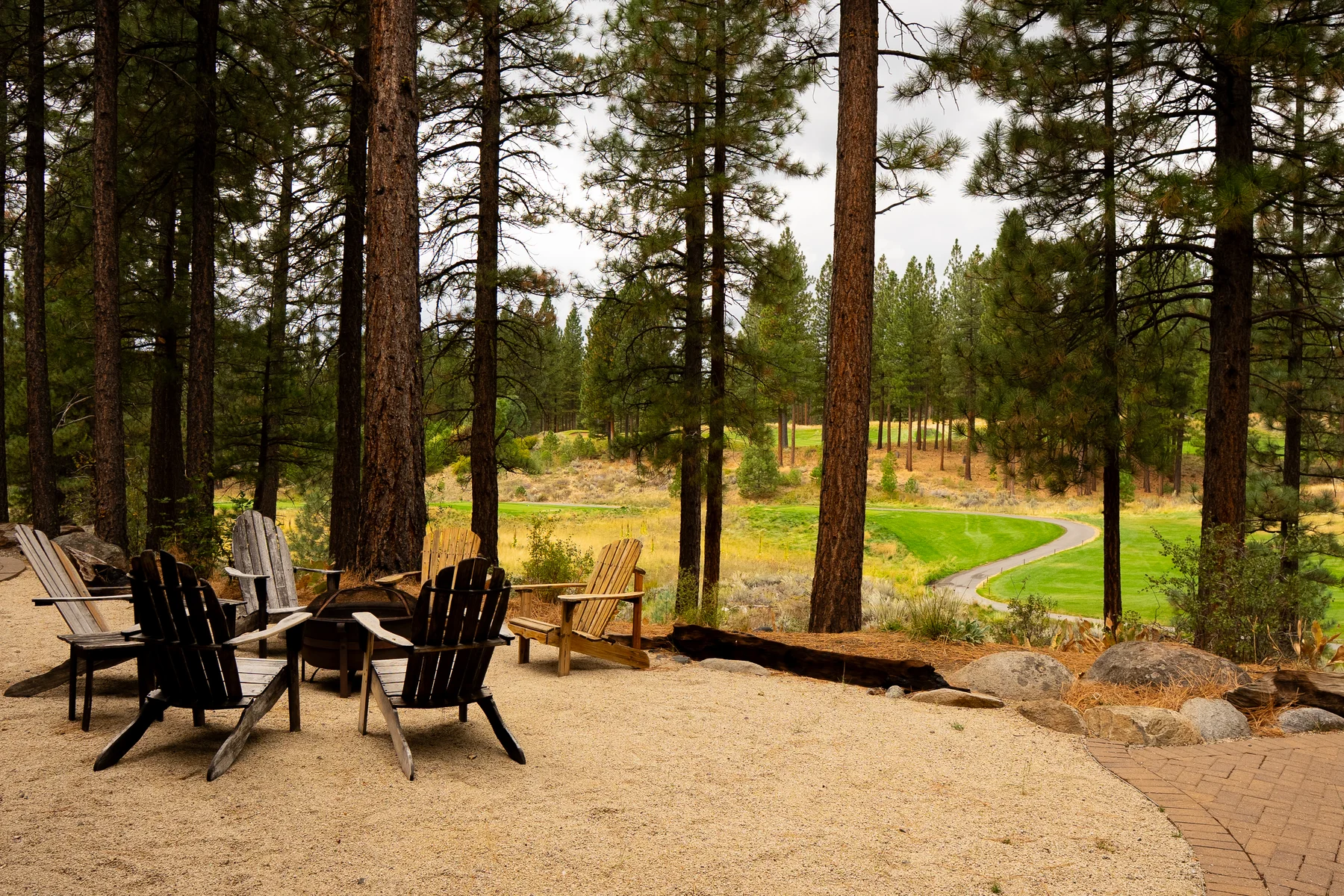 Grizzly Ranch — fire pit and Adirondack chairs overlooking the course