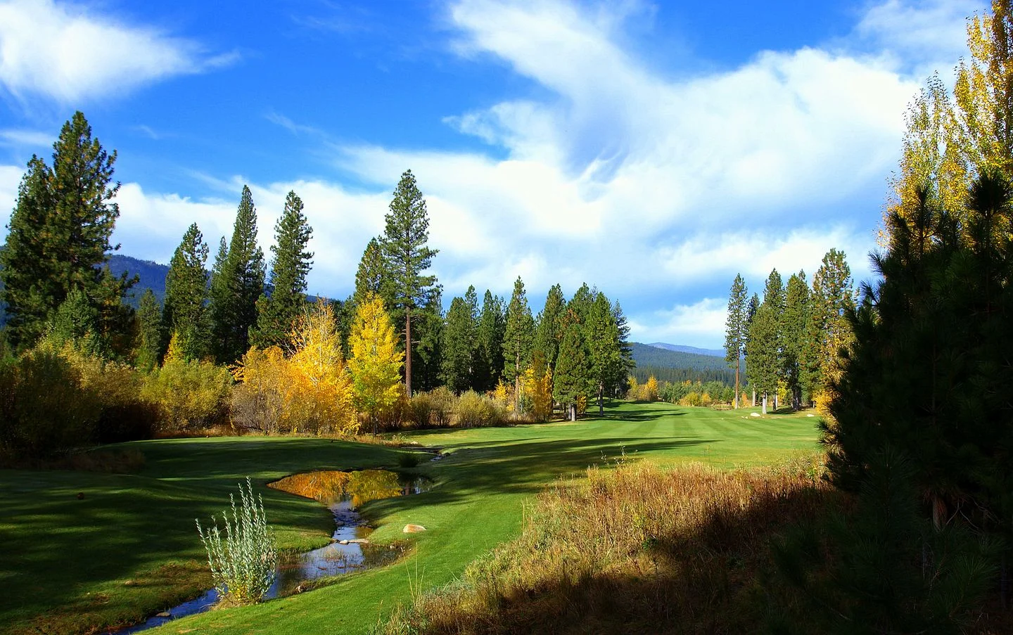 Whitehawk Ranch Golf Club — fairway with Sierra Nevada mountain backdrop